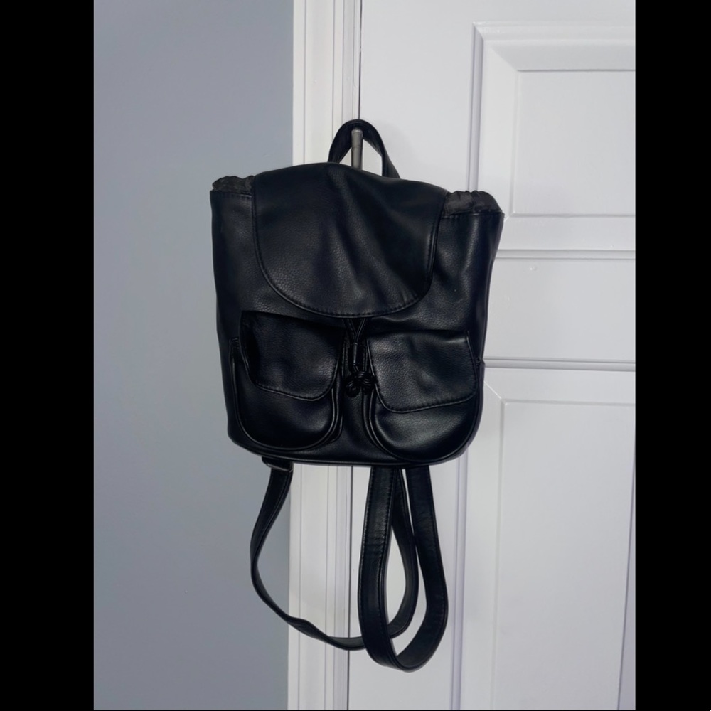 Backpack style black leather bag
